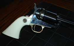Colt SAA with gold cross medallion